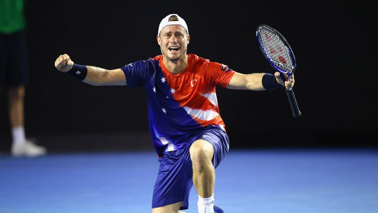 Lleyton Hewitt celebrates winning match point during his first round match against James Duckworth