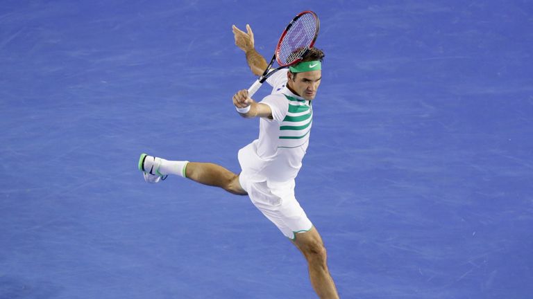 Roger Federer plays a backhand hand in his fourth round match against David Goffin