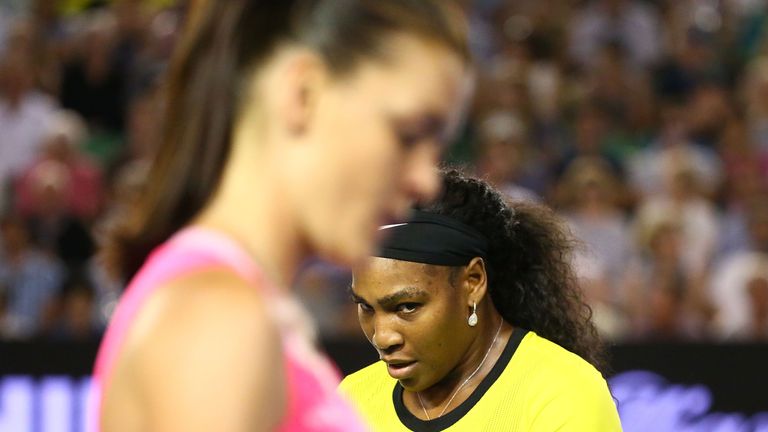 Serena Williams looks at Agnieszka Radwanska as they change ends