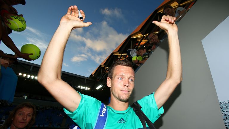 Tomas Berdych signs autographs for fans after winning his match against Roberto Bautista Agut
