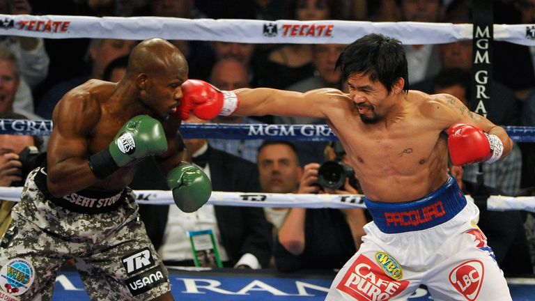 Timothy Bradley (L) and Manny Pacquiao battle it out during their WBO world welterweight championship boxing match at the MGM Gr