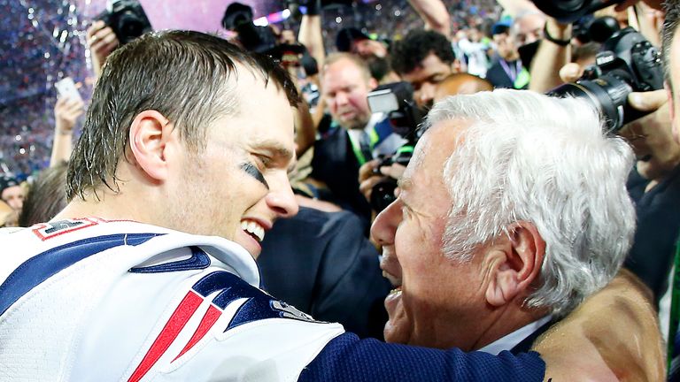 Tom Brady #12 of the New England Patriots celebrates with team owner Robert Kraft after defeating the Seattle Seahawks =