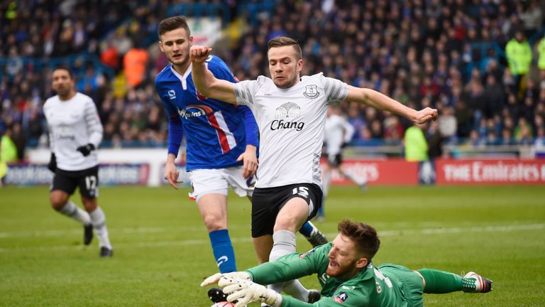 Tom Cleverley of Everton challenges for the ball withCarlisle goalkeeper Mark Gillespie