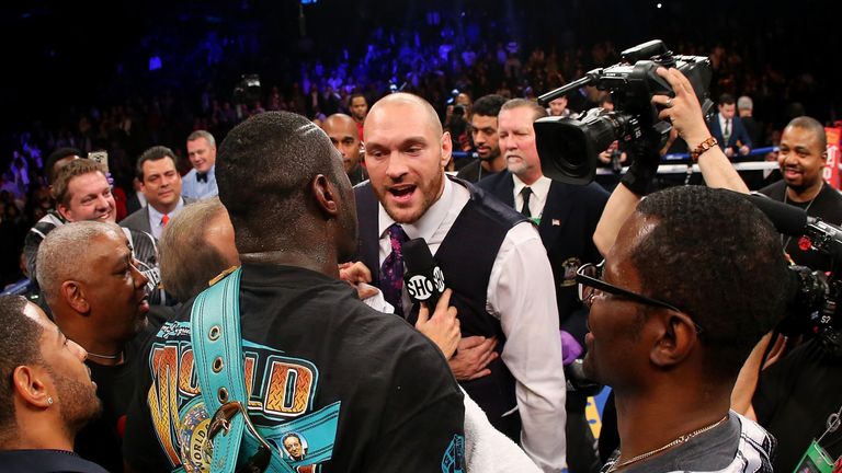 Deontay Wilder and Tyson Fury exchange words
