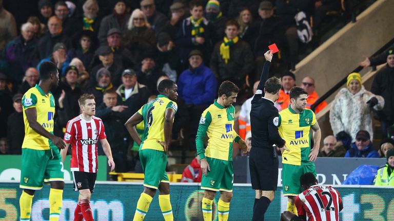 Victor Wanyama (sitting down) was sent off during the second half