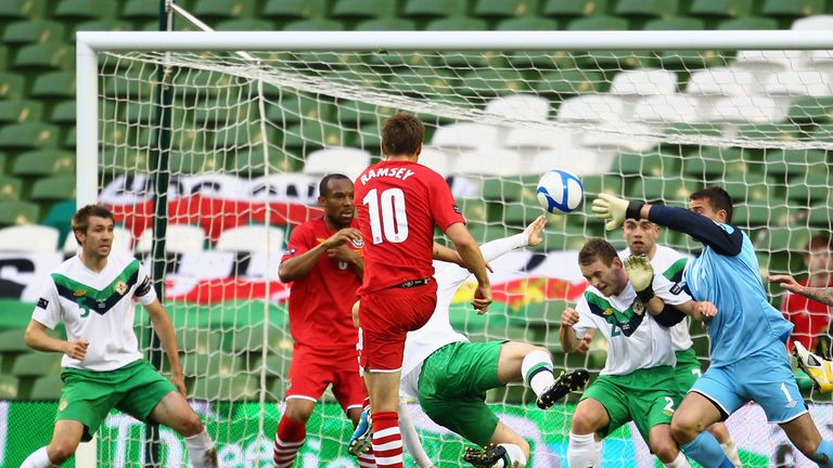 Aaron Ramsey of Wales blasts the ball into the back of the Northern Ireland net to score the opening goal during the Carling Nations Cup match 