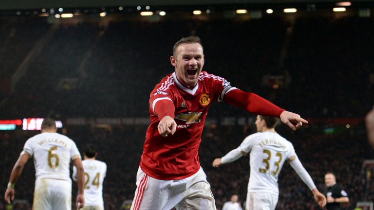 Manchester United striker Wayne Rooney celebrates scoring his team's second goal against Swansea City to make it 2-1