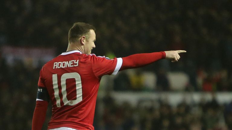 Wayne Rooney of Manchester United celebrates scoring their first goal 