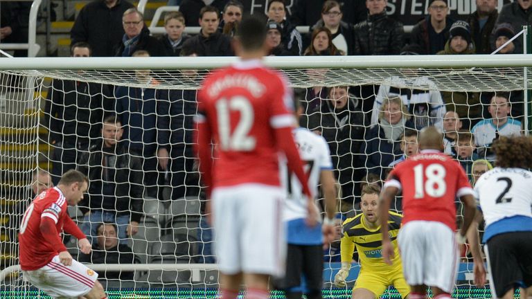 Wayne Rooney scores a penalty against Newcastle