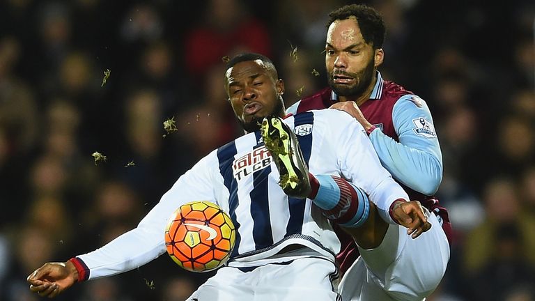 WEST BROMWICH, ENGLAND - JANUARY 23:  Victor Anichebe of West Bromwich Albion controls the ball under pressure of Joleon Lescott of Aston Villa during the 