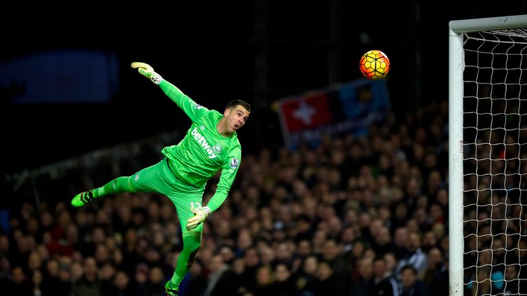 West Ham goalkeeper Adrian watches the ball hit the post 