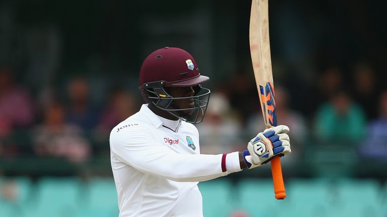 Carlos Brathwaite of West Indies celebrates after reaching his half century during day two of the third Test match