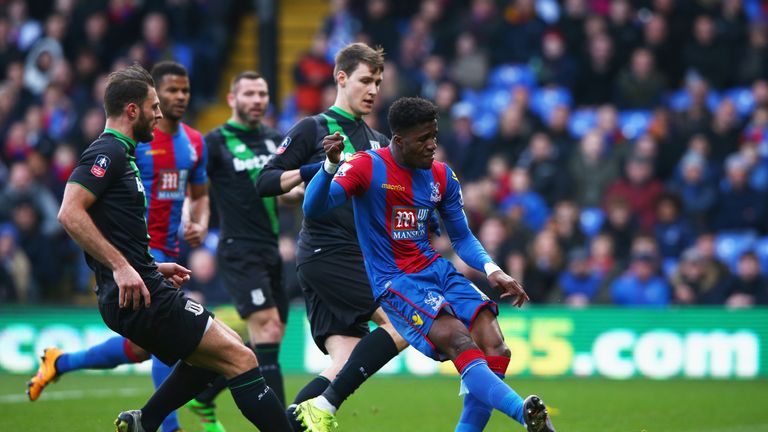 Crystal Palace's Wilfried Zaha scores his team's first goal during the FA Cup fourth round match against Stoke City
