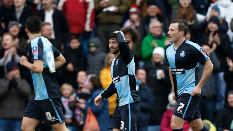 Wycombe Wanderers' Joe Jacobson (centre) celebrates scoring his side's first goal of the game from the penalty spot during the Emirates FA Cup, third round