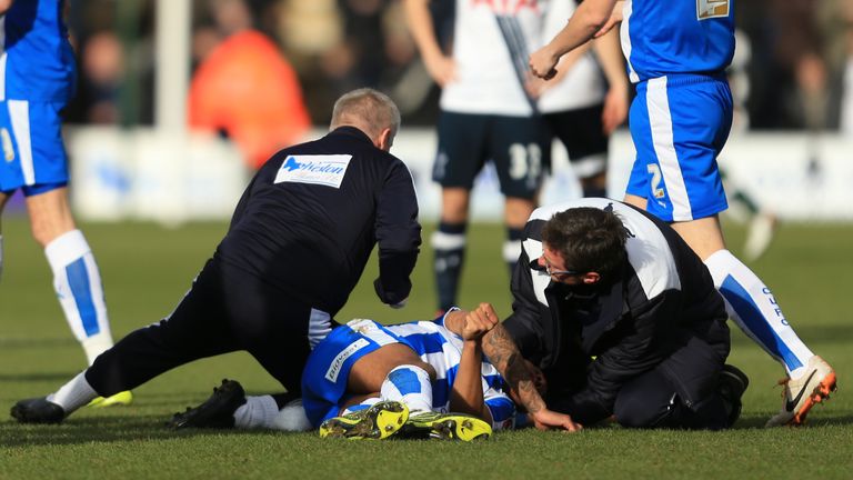 Alex Wynter treated after injuring his head in the FA Cup