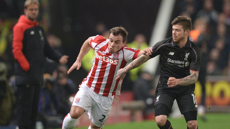 Stoke's Xherdan Shaqiri takes on Liverpool defender Alberto Moreno
