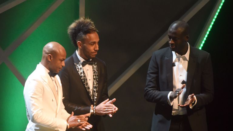 Ivorian striker Yaya Toure (R) and his Ghanaian counterpart Andre Ayew (L) applauds Gabonese striker Pierre-Emerick Aubameyang