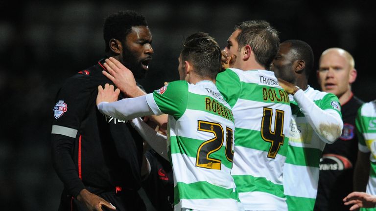 Matthew Dolan and Jabo Ibehre clash during the FA Cup third-round replay