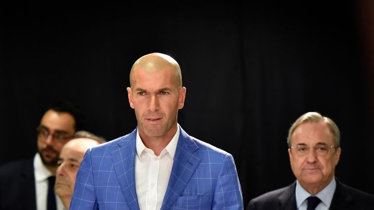 Real Madrid's new coach Zidane (L) arrives with Real Madrid's president Florentino Perez