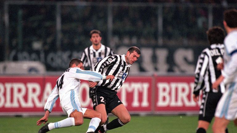 Zinedine Zidane of Juventus holds the ball from Diego Simeone of Lazio during the Italian Serie A match in April 2000