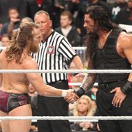 Daniel Bryan and Roman Reigns shake hands after the latter's triumph