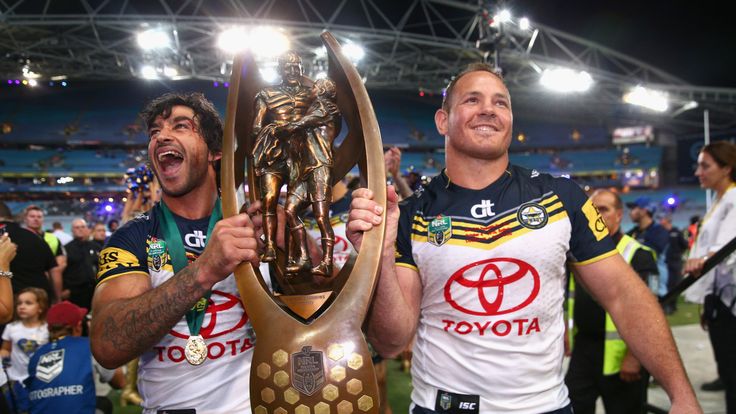 Cowboys captain Johnathan Thurston and captain Matthew Scott hold the Premiership trophy