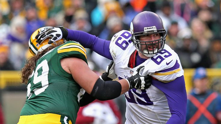 Jared Allen #69 of the Minnesota Vikings rushes against David Bakhtiari #69 the Green Bay Packers at Lambeau Field on Novembe