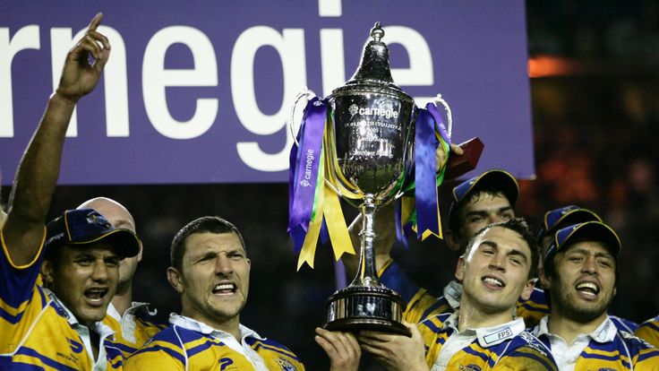 Barrie McDermott (L) and Kevin Sinfield (R) lift the Trophy after the World Club Challenge match between Leeds Rhinos and the Canterbury Bulldogs