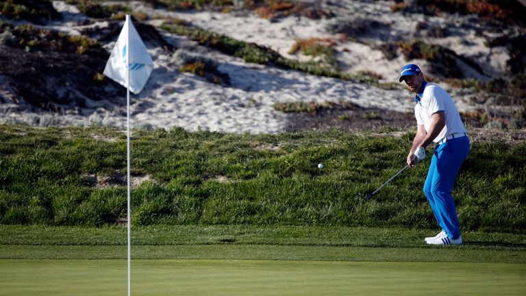 Aaron Rodgers chips onto the third green during the first round of the AT&T Pebble Beach National Pro-Am