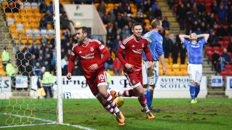 Aberdeen's Niall McGinn (left) celebrates after putting away the third goal of the game for his side 