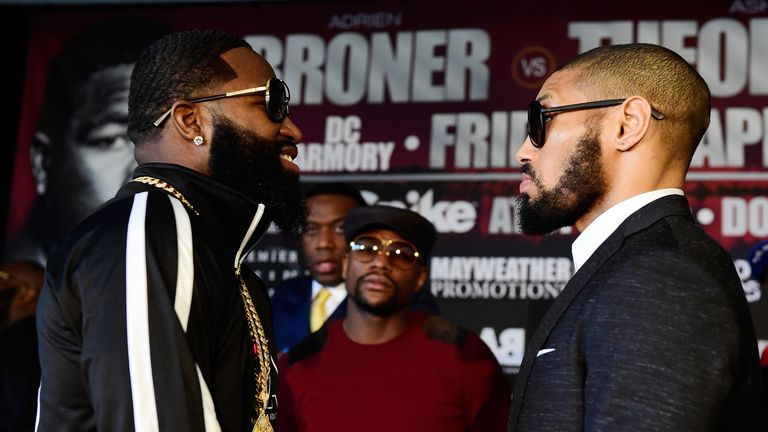  Adrien Broner (L) and Ashely Theophane go face to face during a press conference to announce the fight between Adrien Broner