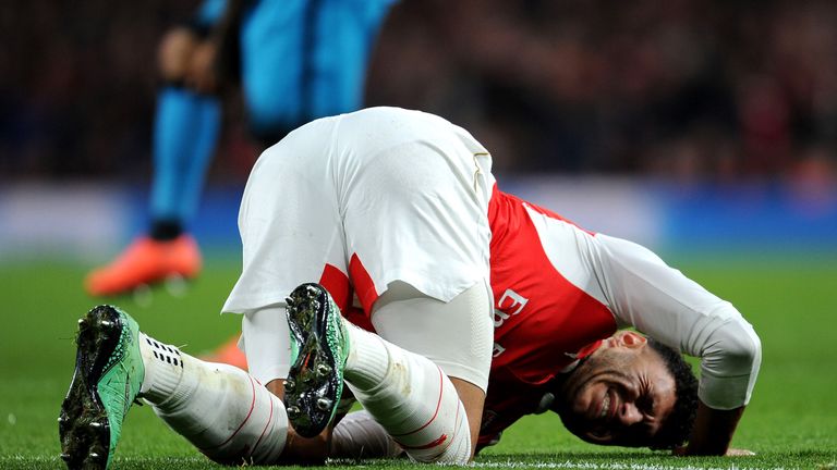 Arsenal's Alex Oxlade-Chamberlain injured during the UEFA Champions League Round of 16, 1st leg match between Arsenal and Barcelona at Emirates Stadium