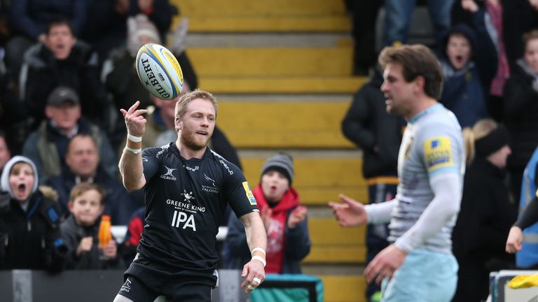 Newcastle's Alex Tait celebrates after scoring the first try