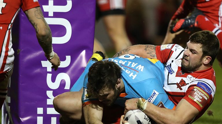 Alex Walmsley powers his way over for St Helens' first try