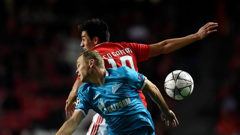 Zenit's Alexander Anyukov vies with Benfica's Nicolas Gaitan