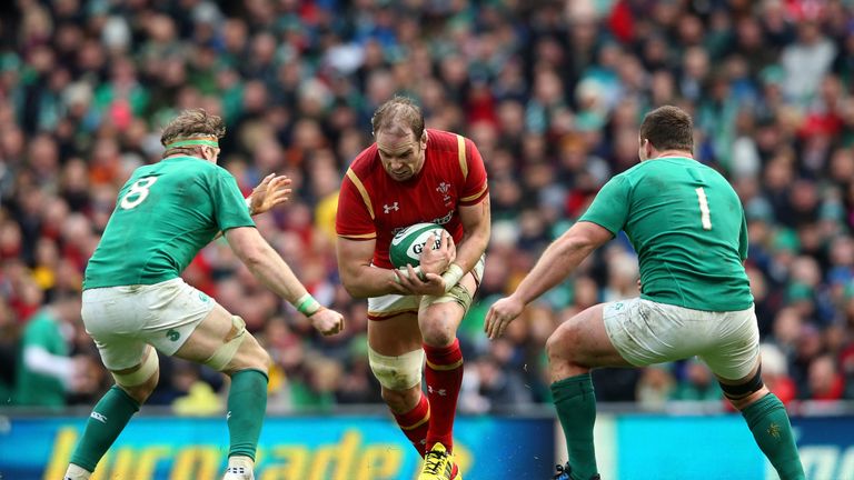 Alun Wyn Jones of Wales is confronted by Jamie Heaslip and Jack McGrath