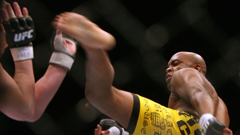 Anderson Silva(R) throws a kick at Travis Lutter of the US on his way to victory in their UFC 67: All or Nothi