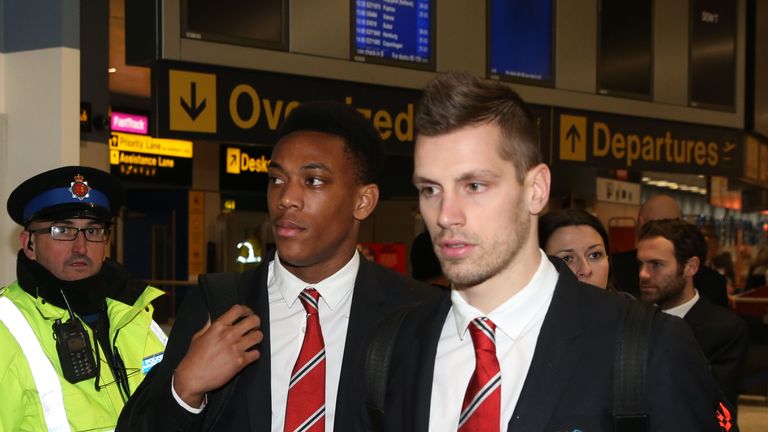Anthony Martial and Morgan Schneiderlin depart from Manchester Airport ahead of Manchester United's Europa League match against FC Midtjylland 