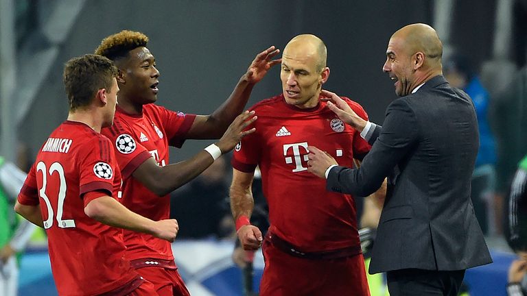 Bayern Munich's Arjen Robben (2nd-R) celebrates with team-mates and Pep Guardiola