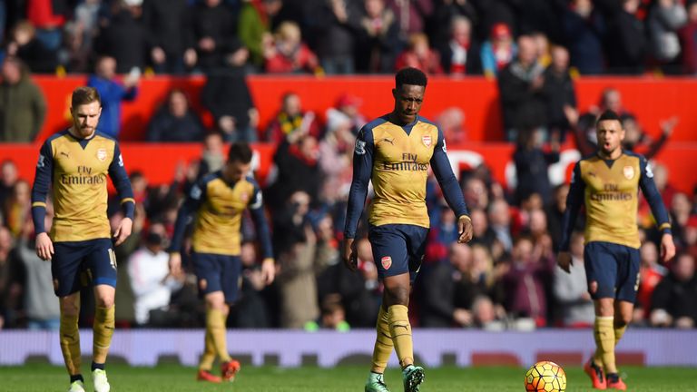 Arsenal players look dejected after conceding against Manchester United