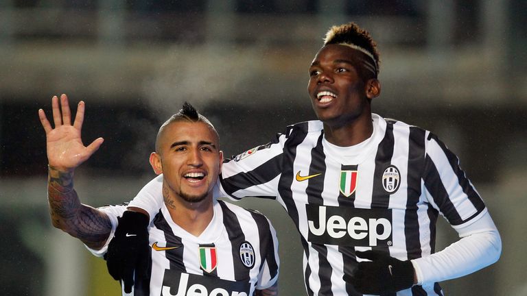 BERGAMO, ITALY - DECEMBER 22:  Arturo Vidal (L) of Juventus celebrates with teamt-mate Paul Pogba after scoring their fourth goal during the Serie A match 
