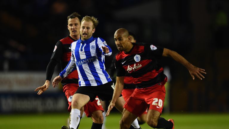 Barry Bannan of Sheffield Wednesday battles with Karl Henry of Queens Park Rangers 