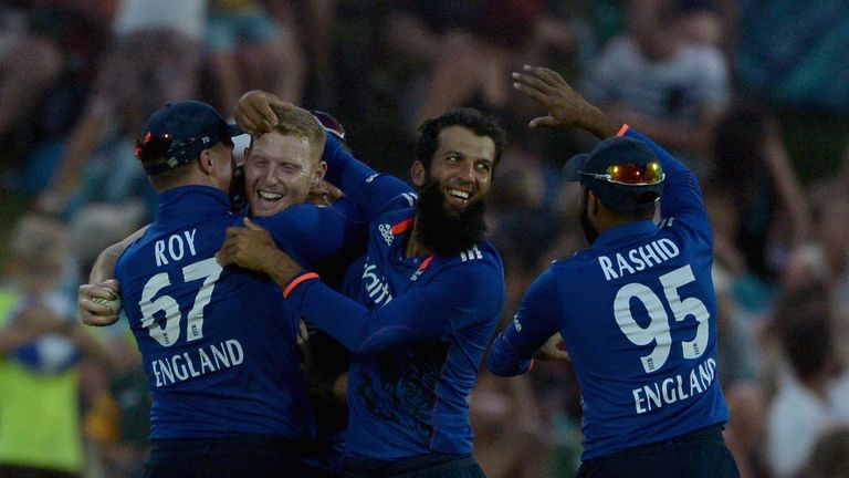 Ben Stokes of England is mobbed by team-mates