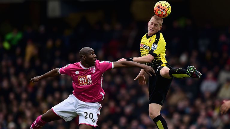 Ben Watson of Watford heads the ball away from Bournemouth's Benik Afobe