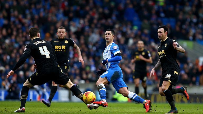 Beram Kayal of Brighton holds off the Bolton defence to play a through ball