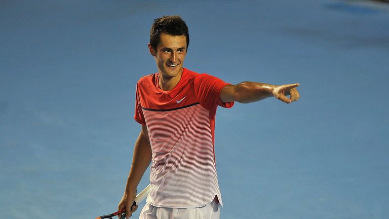 Australia's tennis player Bernard Tomic celebrates after winning to Ukraine's tennis player Alexandr Dolgopolov 