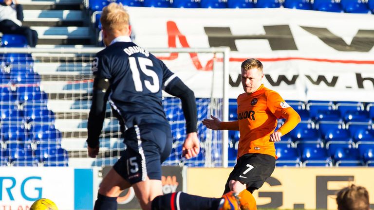 Dundee United striker Billy McKay scores his team's second goal against Ross County