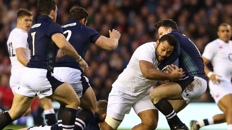 Billy Vunipola of England charges into Matt Scott of Scotland during the RBS Six Nations clash at Murrayfield