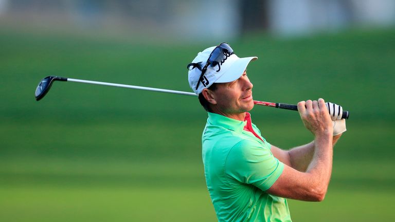 Brett Rumford of Australia plays his second shot on the par 5, 10th hole during the first round of the 2016 Omega Dubai Desert Classic