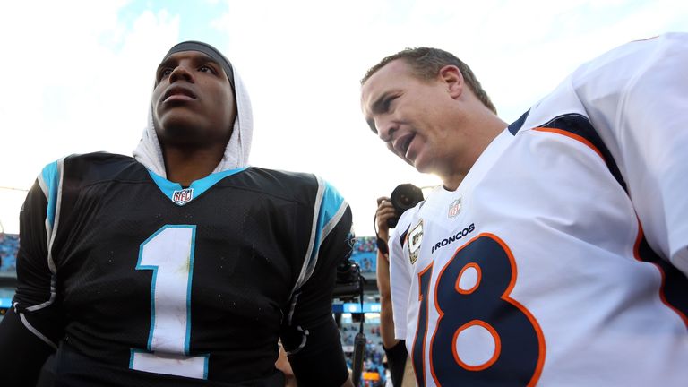 Cam Newton #1 of the Carolina Panthers talks to Peyton Manning #18 of the Denver Broncos after their game at Bank of America 